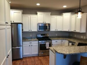 refinished and painted white kitchen cabinets