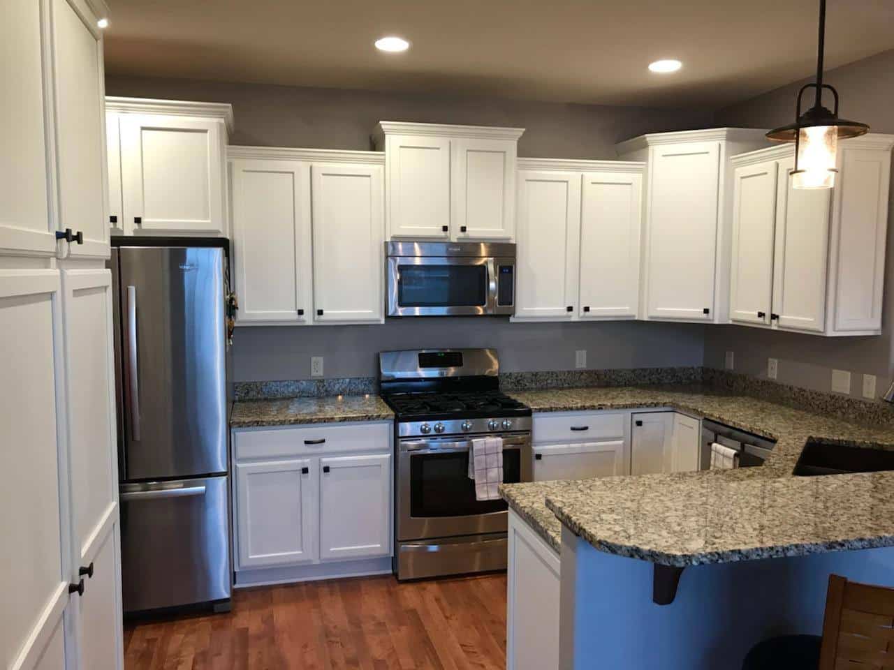 refinished and painted white kitchen cabinets